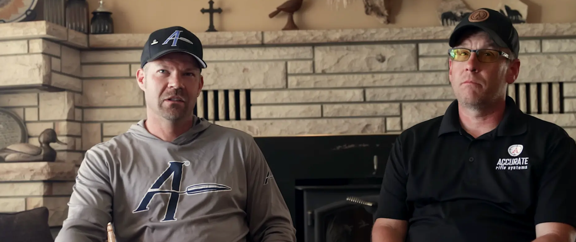 Rusty Newton and Joe Updike seated in front of a stone fireplace, talking through load development on the Applied Ballistics interview